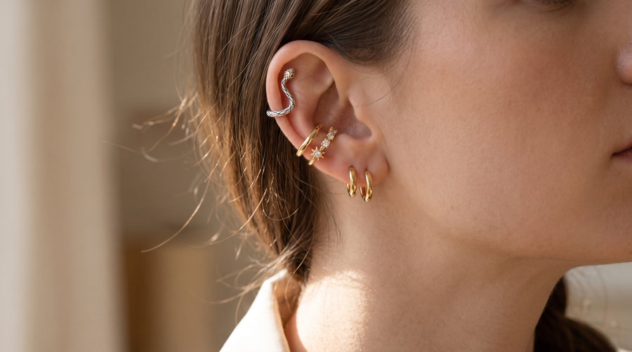 How to wear ear cuffs: snake and star cuffs on the ear rim with small huggie hoops in the lobe