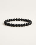 Onyx bracelet with matte black round beads on a white background