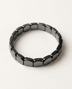 Bracelet hématite à perles noires polies aux reflets métalliques