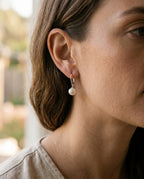 Pearl leverback earrings worn with hair tied back
