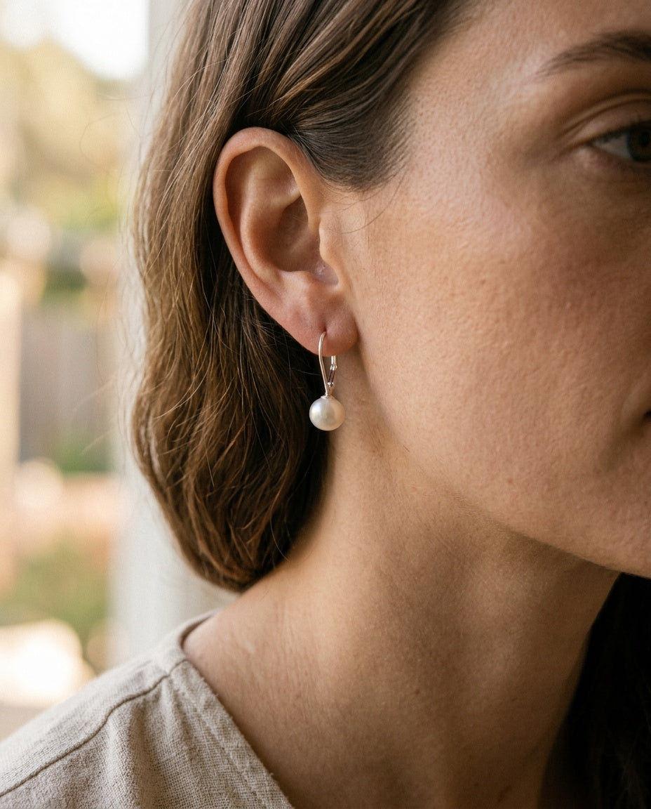 Pearl leverback earrings worn with hair tied back