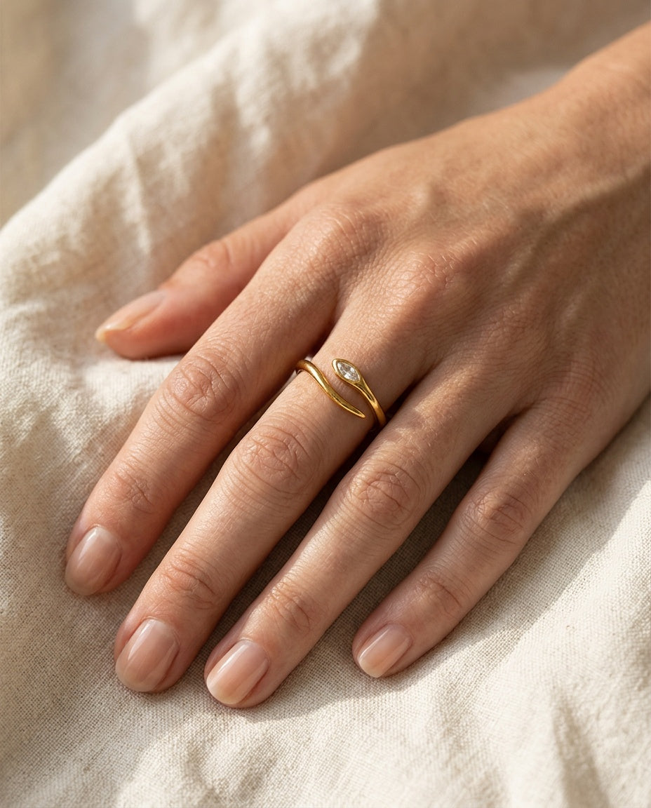 Slim serpent ring worn on the ring finger