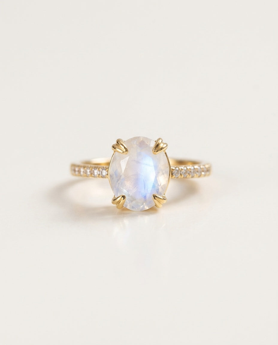 Moonstone ring with an oval stone and zircon band, packshot