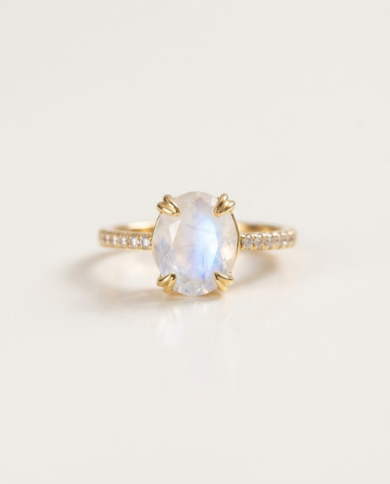 Moonstone ring with an oval stone and zircon band, packshot