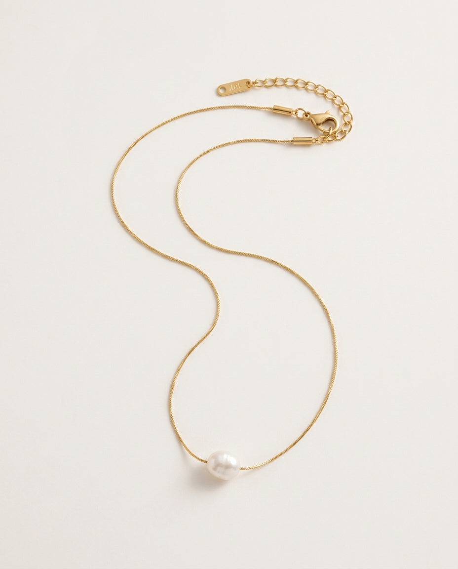 Pearl charm necklace with a freshwater pearl on a fine gold-tone chain