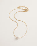 Pearl charm necklace with a freshwater pearl on a fine gold-tone chain