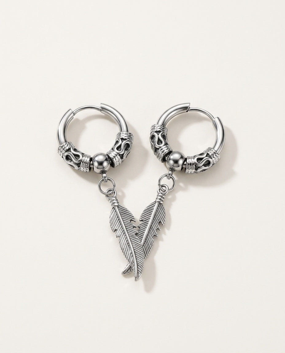 Mens dangle earrings with a stainless steel feather on an engraved hoop, packshot