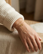 Initial bracelet worn on the wrist