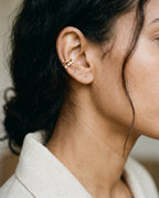 Star ear cuff worn on the middle of the ear