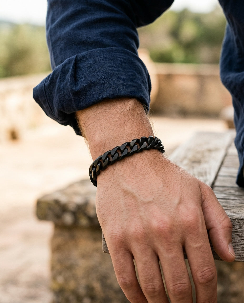 Black chain bracelet worn on a man’s wrist