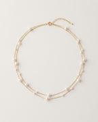Pearl choker with small white pearls on a fine gold chain