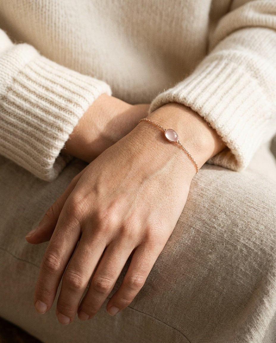 Rose quartz bracelet worn on a woman’s wrist