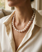 Large pearl necklace worn on the collarbone