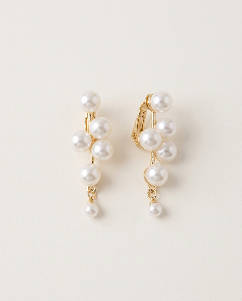 Pearl clip on earrings in six styles on a light background