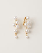 Pearl clip on earrings in six styles on a light background