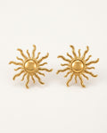 Gold sun earrings, sun stud style, on a white background
