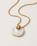 Shell necklace with round natural shell pendant, packshot