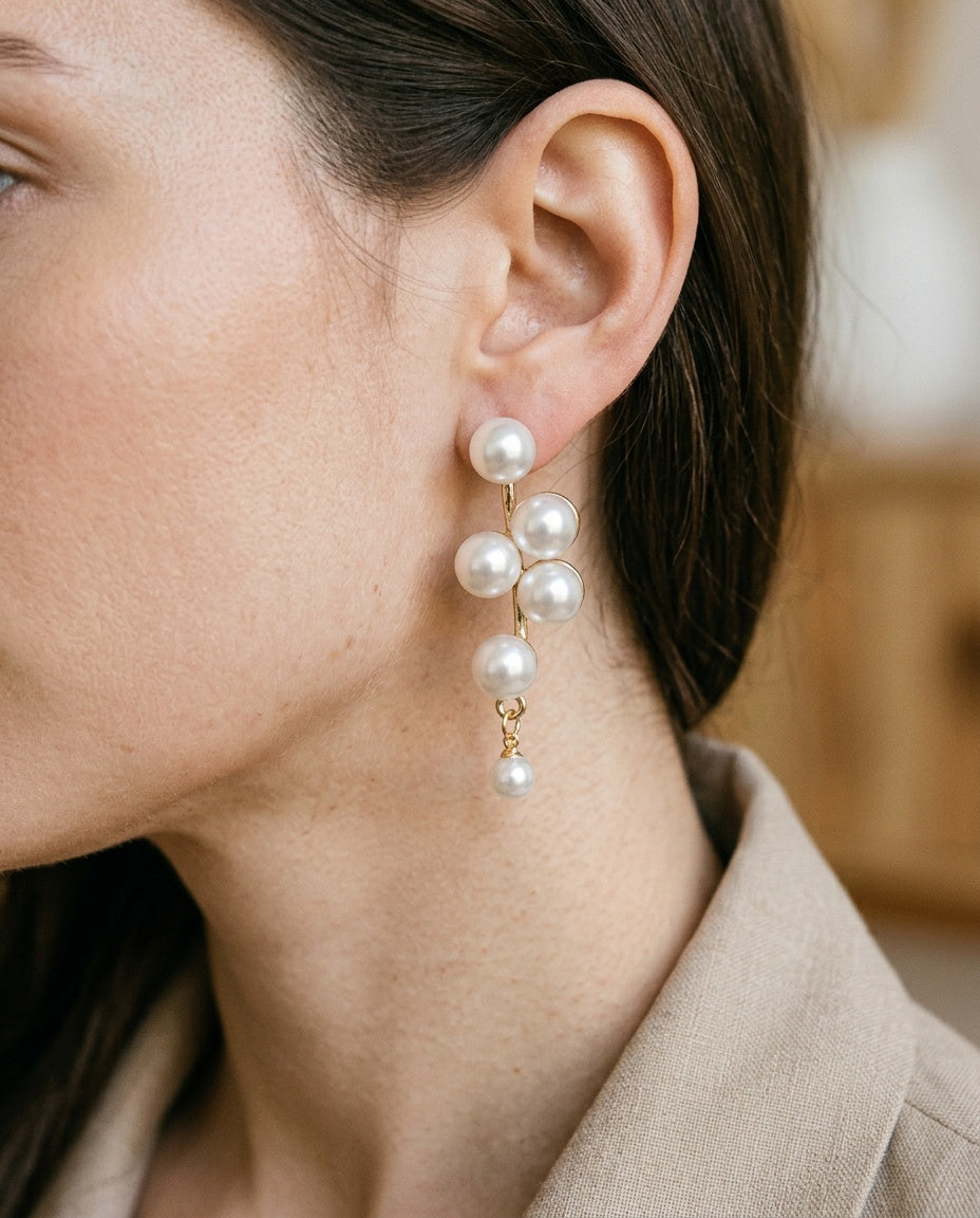 Pearl clip on earrings worn on an unpierced lobe