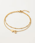 Initial bracelet with heart and letter on two gold chains, packshot