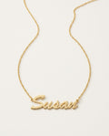 Gold name necklace with a name in flowing script on a fine chain