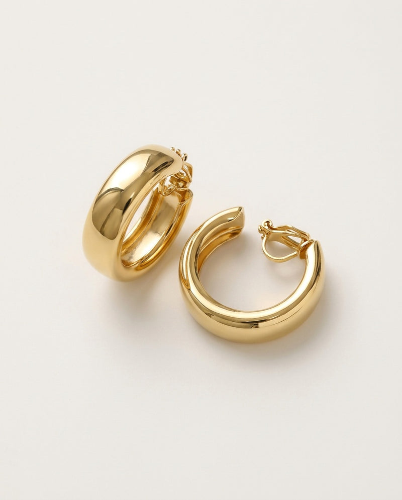 Clip on hoop earrings in gold tone, wide polished hoops