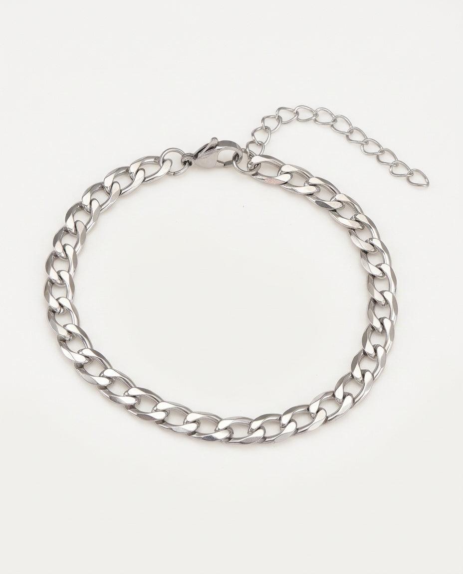 Gold curb link bracelet with flat polished links and lobster clasp