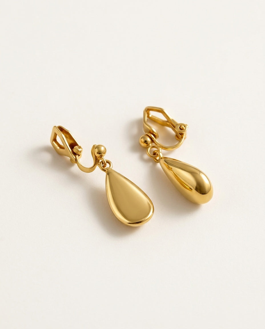 Dangle clip on earrings with gold teardrop drops