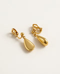 Dangle clip on earrings with gold teardrop drops