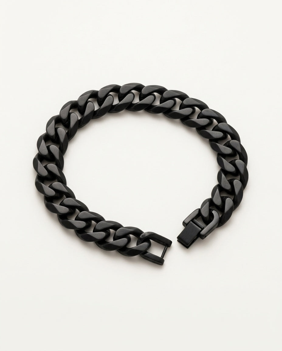 Black chain bracelet with Cuban curb links held in the hand