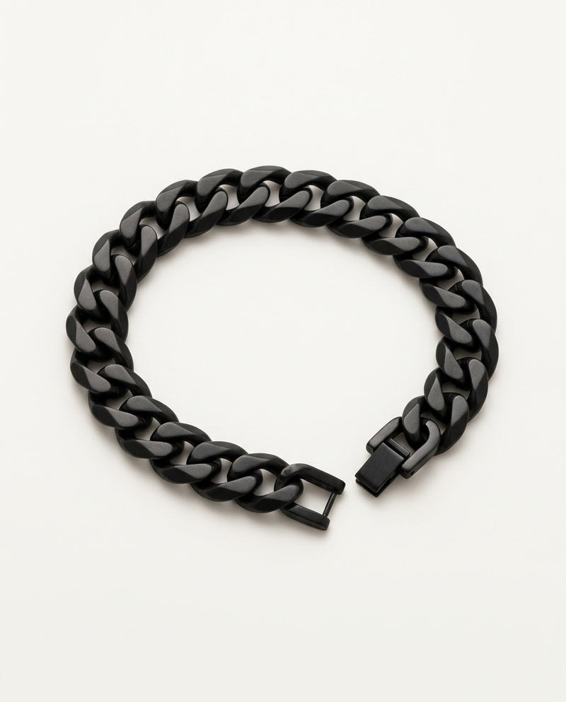 Black chain bracelet with Cuban curb links held in the hand