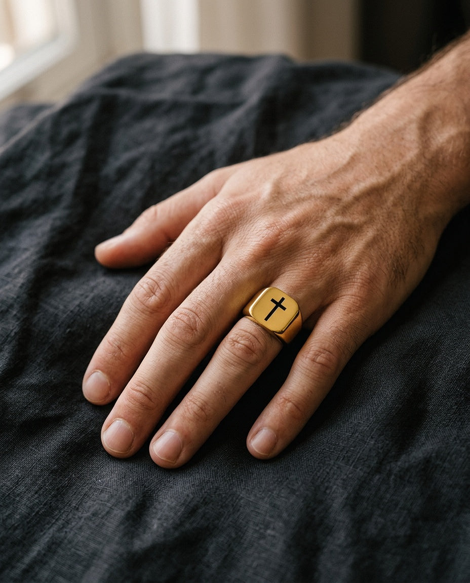 Cross ring worn on a man’s ring finger