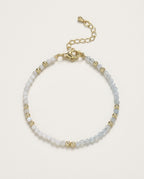 Bracelet pierre de lune en perles facettées et détails dorés