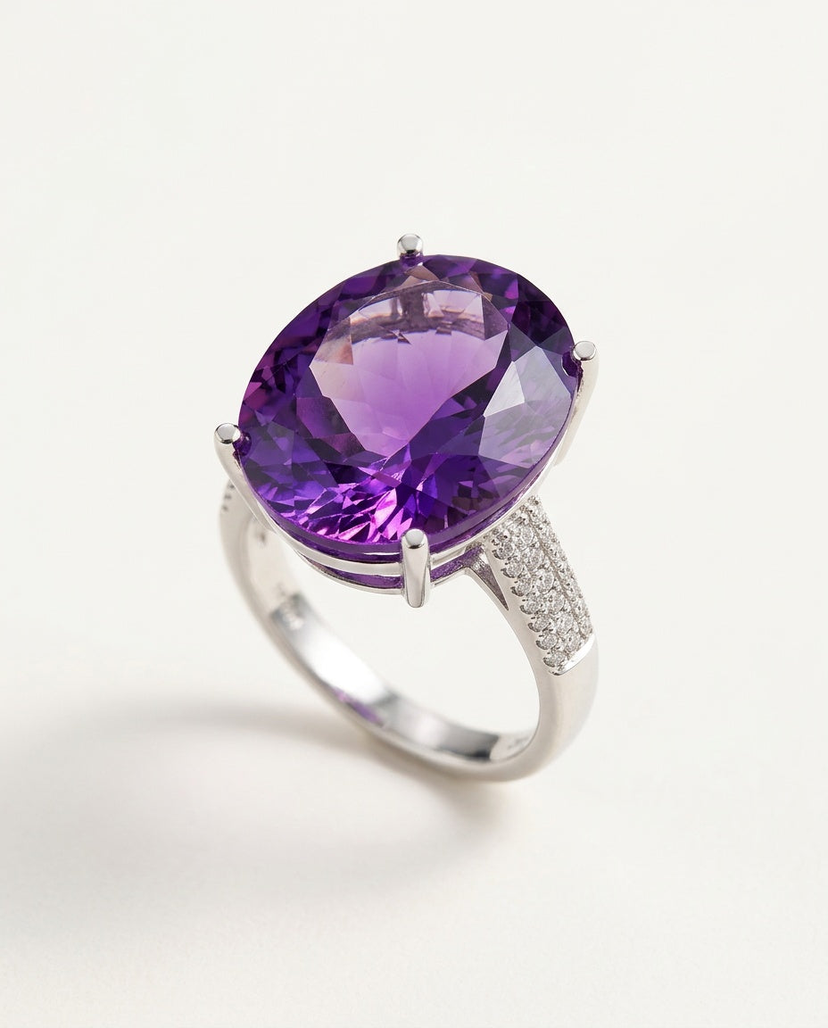 Amethyst ring with faceted purple stone in sterling silver