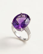 Amethyst ring with faceted purple stone in sterling silver