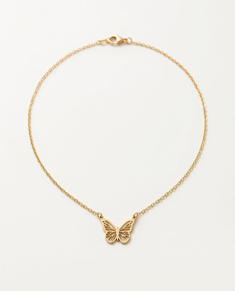 Gold butterfly necklace with an open-wing pendant