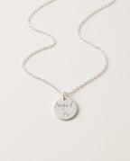 Engraved necklace with round disc in gold on a fine chain