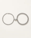 Magnetic couple bracelets in stainless steel with two half-hearts