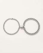 Magnetic couple bracelets in stainless steel with two half-hearts