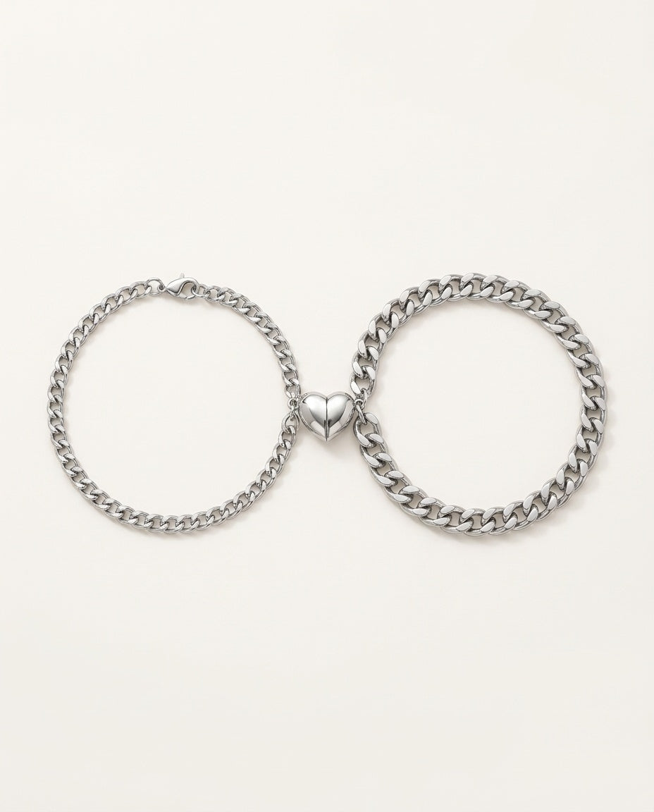 Magnetic couple bracelets in stainless steel with two half-hearts