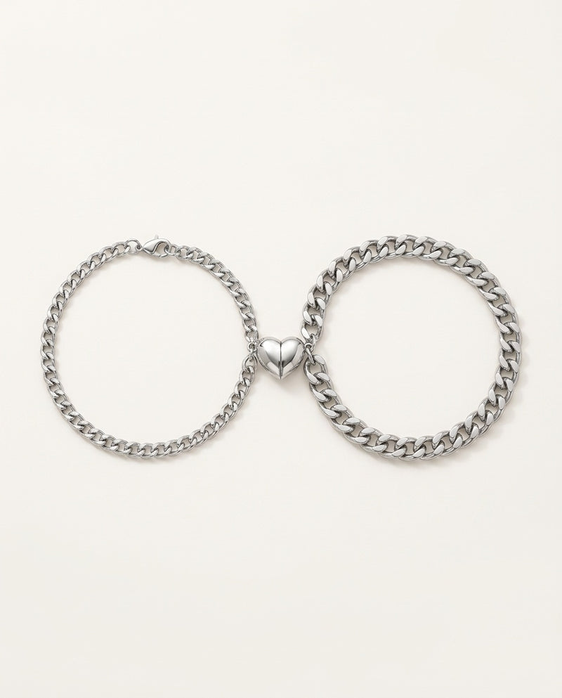Magnetic couple bracelets in stainless steel with two half-hearts
