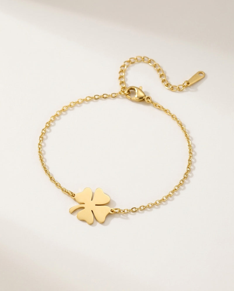 Gold clover bracelet with a four-leaf clover charm on a fine chain