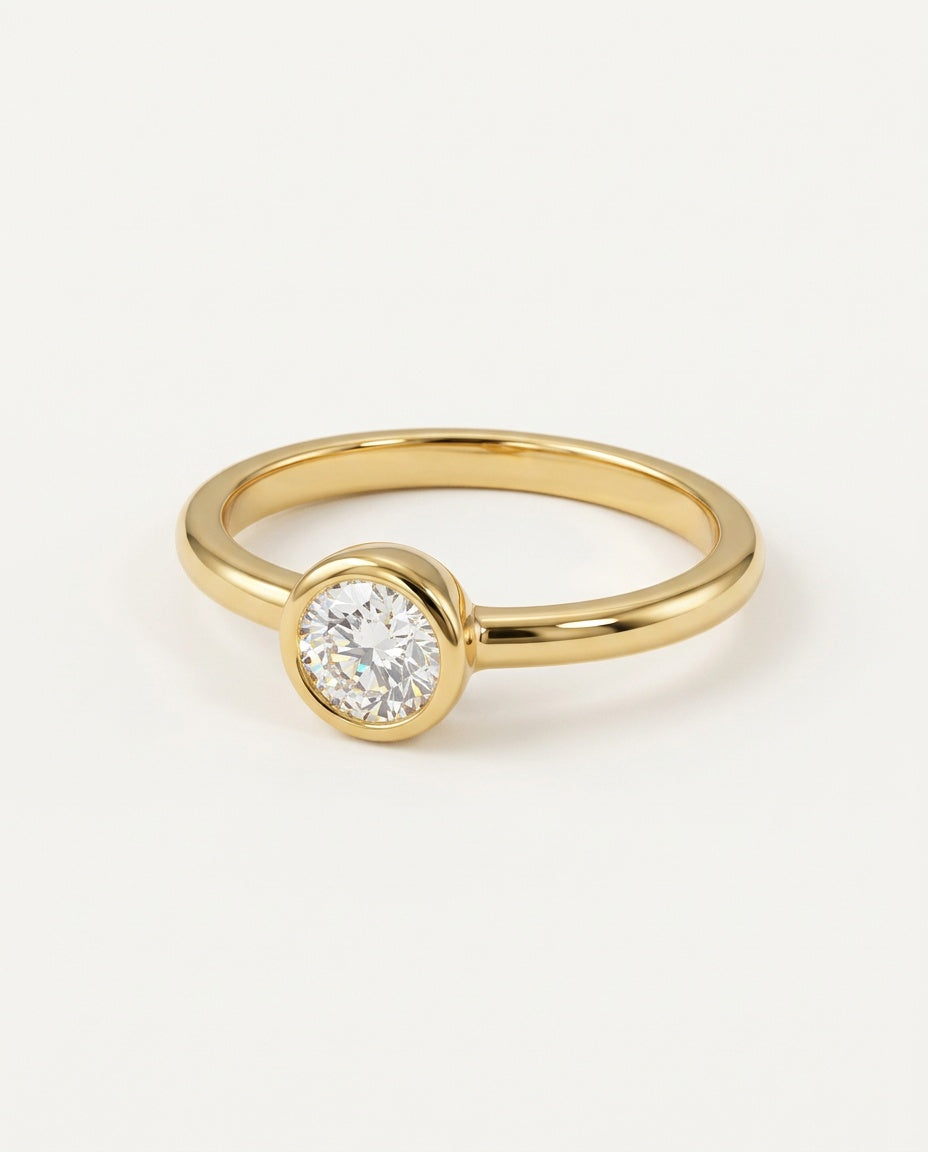 Gold promise ring with a round moissanite in a bezel setting