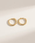 Gold huggie earrings, small smooth round hoops