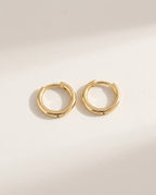 Gold huggie earrings, small smooth round hoops