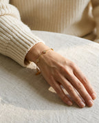 Flower bracelet worn on the wrist with a slim watch