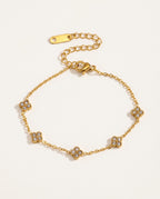 Gold flower bracelet with small zircon flowers on a fine chain