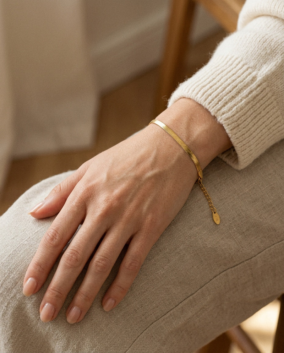 Chain bracelet worn stacked on a woman’s wrist