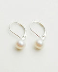 Leverback earrings with white freshwater pearls on sterling silver