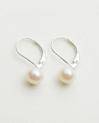 Leverback earrings with white freshwater pearls on sterling silver