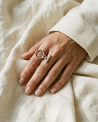 Silver chain ring worn on the index finger